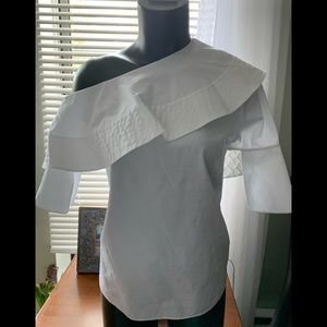 White off shoulder blouse by  Victoria Beckham